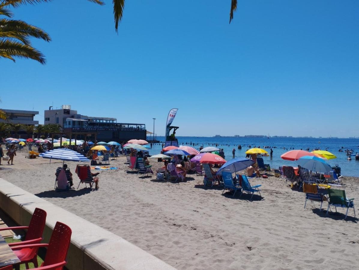 Beach with parasols on the Mar Menor in San Pedro del Pinatar