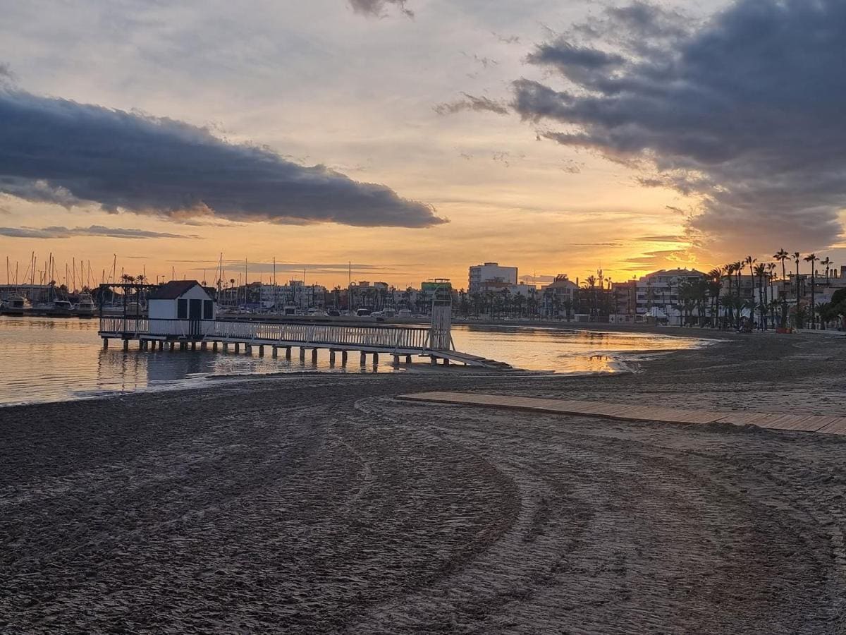 Sunset over the harbour and promenade of San Pedro del Pinatar