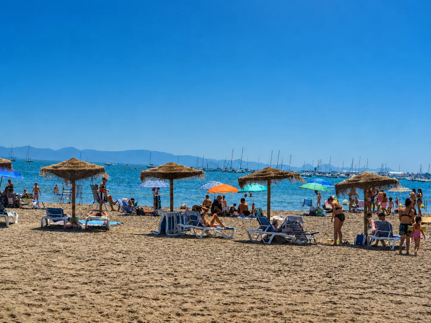 Lively beach with parasols on the Mar Menor